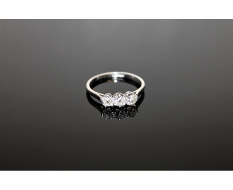 A platinum diamond three stone ring, approximately 0.75ct, size N.