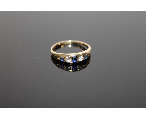 An 18ct gold diamond and sapphire ring, size L, 2.5g.