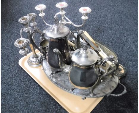 A tray of assorted plated wares including a four-piece plated tea service on tray, pair of three way candelabra, assorted cut