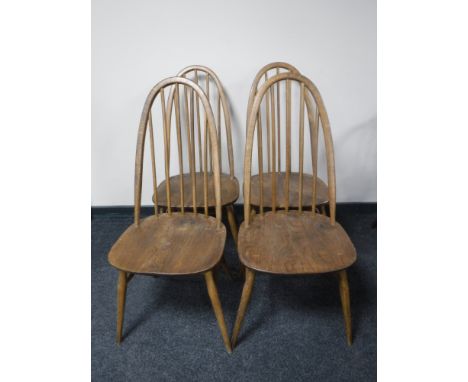 A set of four Ercol elm high back dining chairs 