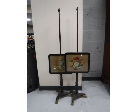 A pair of early Victorian rosewood tapestry pole screens 
