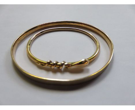 GOLD COLOURED SNAKE FORM BANGLE AND ROLLED GOLD BANGLE