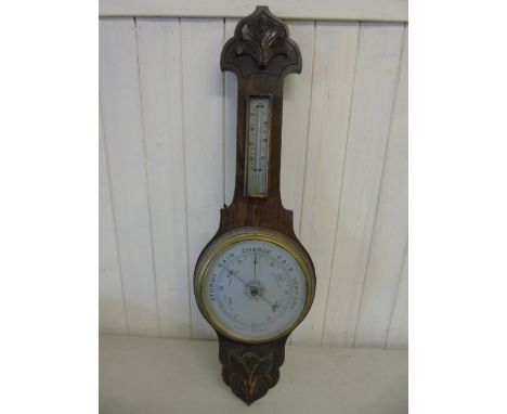 Carved oak cased barometer