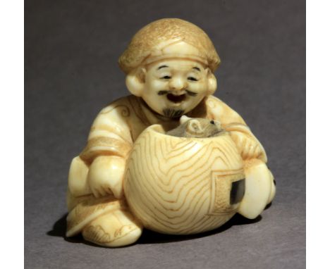 Signed Hidekazu on a red kanji on the base. In carved elephant tusk inlaid with horn and mother of pearl portraying Daikoku s