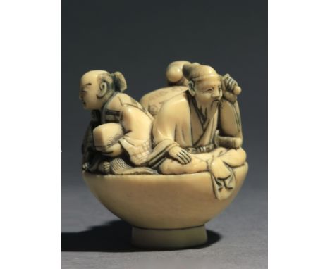 Signed Hideyuki. In carved elphant tusk portraying The Three Wise Men tea drinkers sat inside a big tea cup. One of them has 