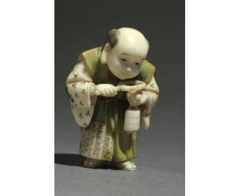 Signed Mitsuyuki on a red kanji on the back. In carved and inlaid elephant tusk portraying a young man looking at a netsuke l