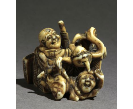 Signed Jugyoku II-Ryukosai on the base. In carved elephant tusk portraying a Rokurobi with its long neck, licking Daikoku's c