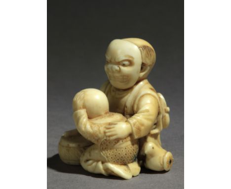 Not signed. In carved elephant tusk portraying a Karako wearing a mask and hiding a fan with his right hand while with hislef