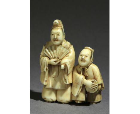 Signed Mitsuraku on one side. In carved ivory tusk portraying a pair of actors, one of then stand up and holding an open fan 