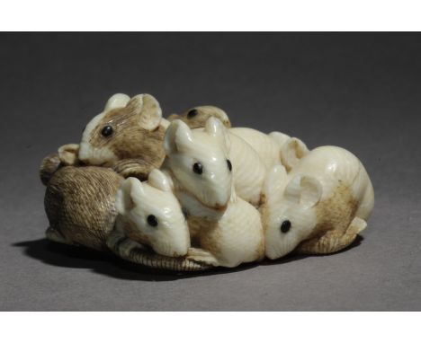 Signed Tadachika on the base. In carved elephant tusk and horn portraying a group of seven rats piled forming a circle, 26,3x
