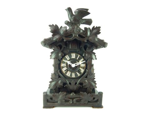 Bavarian cuckoo clock, oak stain case with bird and vine facia, twin fusee movement, brass Beha movement striking on a coil, 