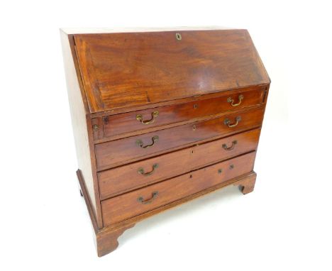 A 19th C mahogany writing bureau, the fall front enclosing a fitted and shelved interior, over four graduated drawers, raised