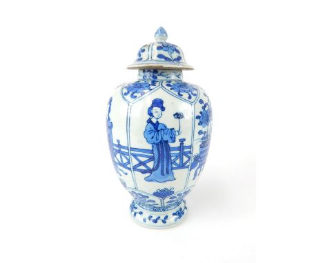 A Chinese blue & white porcelain temple jar with lid, decorated with four ladies playing in the garden, 22 cm h