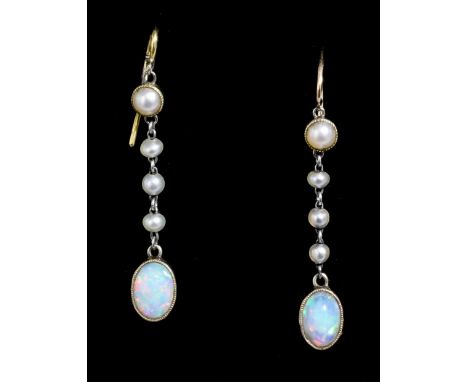 A pair of modern gold and silvery coloured metal mounted opal and seed pearl pendant drop earrings (for pierced ears), the ov