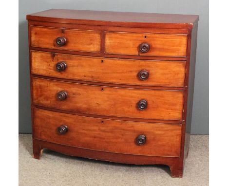 A late Georgian mahogany bow-front chest of drawers fitted two short and three long drawers, on shaped apron and bracket feet