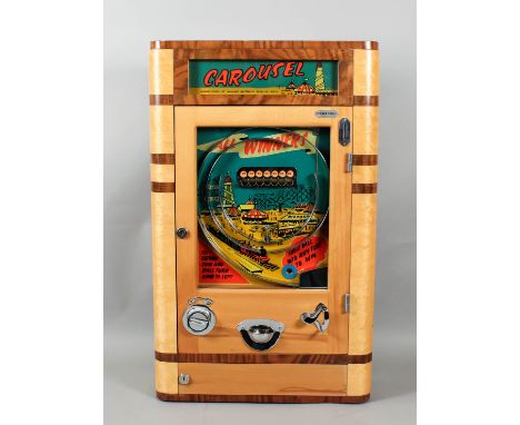 A 1950s Parker's Automatics walnut and birdseye maple cased penny-in-the-slot "Carousel" Alwin with view of fun fair to back 