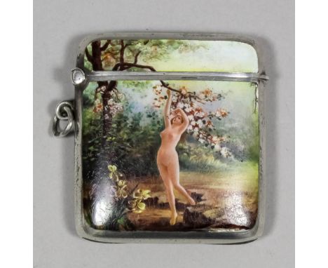An early 20th Century Continental silvery metal and enamel rectangular vesta case of curved outline, the front decorated with