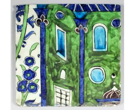 A late 16th/early 17th Century Syrian pottery tile from a larger panel, painted in shades of green, blue and manganese with p