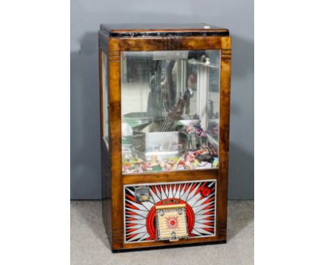 A 1950s Bradley's "Jewel Box" table top penny-in-the-slot grab machine with exposed mechanism, in stained wood and glazed squ