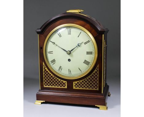 A George III mahogany and gilt brass mounted mantel clock the 8ins diameter white enamelled metal dial with Roman numerals to