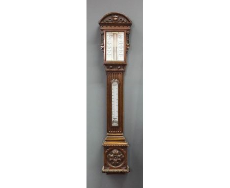 A Victorian oak cased stick barometer and thermometer by Armstrong Brothers, 88 Deansgate, Manchester, with twin white opaque