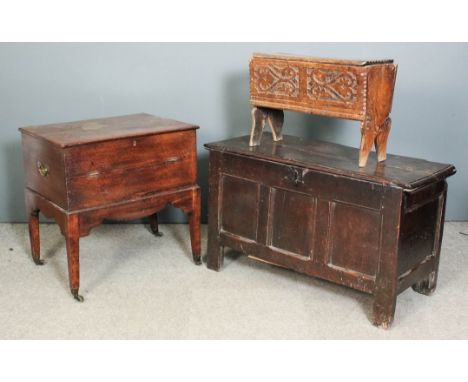 A late 17th/early 18th Century panelled oak coffer with plain lid and three panel front, on stile feet, 43ins wide x 18ins de