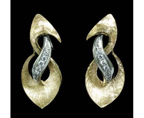 A pair of modern 18ct white and yellow gold mounted diamond set leaf pattern earrings, with screw fittings, each central pane