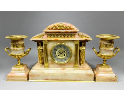 A late 19th Century French gilt metal and onyx cased three piece clock garniture, the clock by Japy Freres, No. 5940, the 4.2