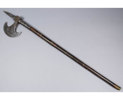 An 18th Century Indo-Persian horseman's axe, the steel blade with "dot" decoration, with wooden haft with applied copper and 