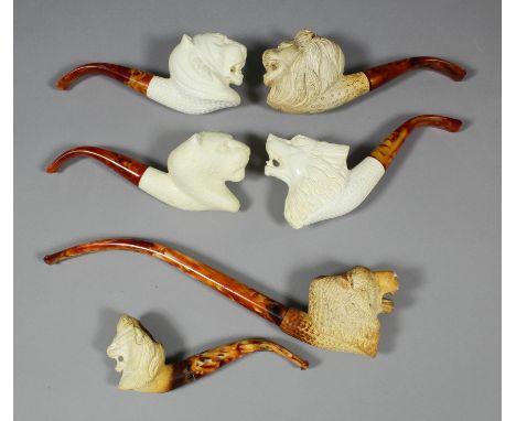 A modern Meerschaum pipe, the bowl carved with the head of a Grizzly Bear with black Churchwarden stem, 9.5ins, three ditto p