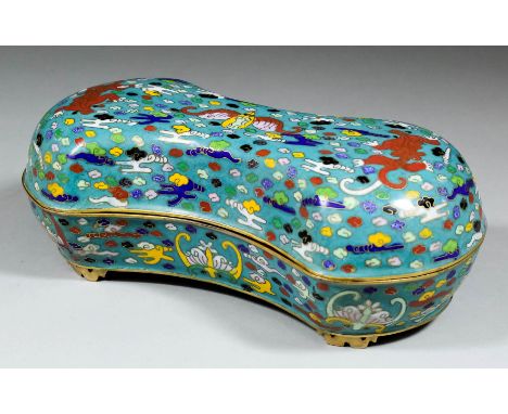 A Chinese gilt brass and cloisonne enamel rectangular box of shaped outline, decorated in colours with stylised mythical beas