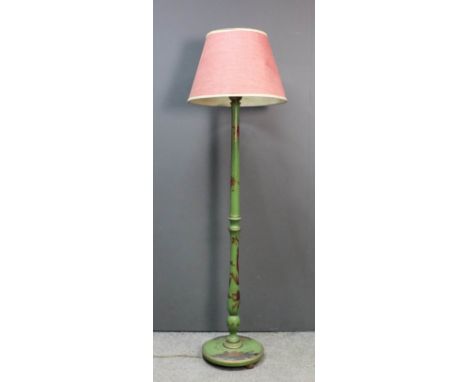 An early 20th Century green lacquered electric standard lamp decorated in colours and gilt with chinoiseries, 60ins high, wit