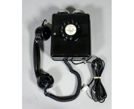 A 1950s Swiss black Bakelite wall mounted telephone with twin bells above by Weidmann (Model No. 4259 - in new unissued condi