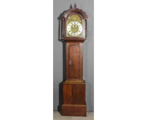 An early 19th Century oak longcase clock housing earlier movement by John Watts of Canterbury, the 12ins square brass dial wi