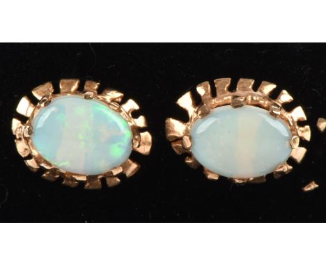 A pair of opal earrings set in 9 ct gold with post and butterfly fittings in jewellery box. Condition Report:  9 ct gross wei