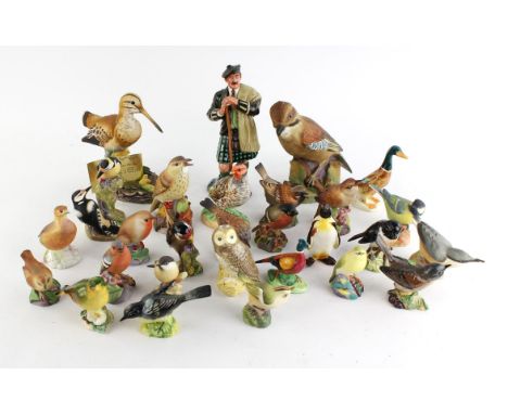 A collection of 27 small birds, mostly Royal Worcester and Beswick and a Royal Doulton figure "The Laird"