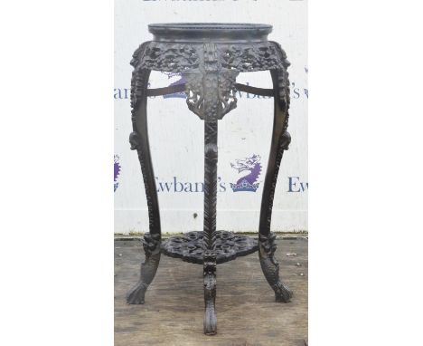 Chinese hardwood stand, late 19th/early 20th century, overall carved with grapes and other motifs, on four legs, H93cm x D41c