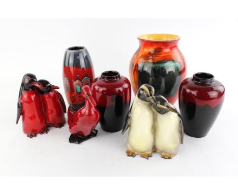 Poole pottery, a studio pottery vase decorated by L Whitmarsh, 17.5 cm high, together with another pottery vase with retailer
