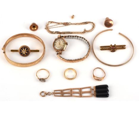 A group of gold jewellery, including a three stone diamond twist ring size O in 18 ct yellow gold and platinum, a textured we