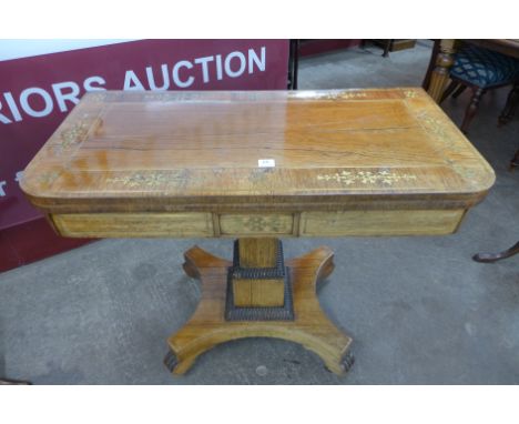 A Regency rosewood and brass inlaid card table