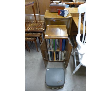 A walnut record cabinet including records and related books, a Wilcox &amp; Gibbs sewing machine and various sewing equipment