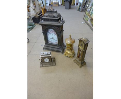 A reproduction ebonised bracket clock with quartz movement and two other clocks, plus an onyx and gilt metal musical cigarett