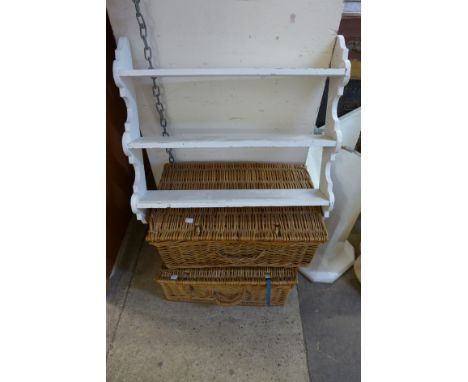 Two wicker picnic baskets and a painted shelf