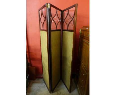 An Edward VII mahogany folding three panel dressing screen