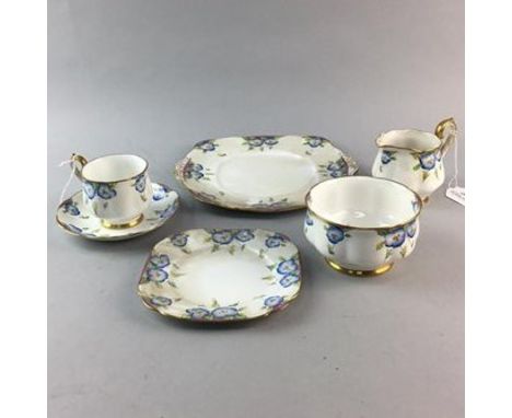 ROYAL ALBERT PANSY PART TEA SERVICE, comprising nine tea cups, twelve saucers and side plates, two sandwich plates, cream, su