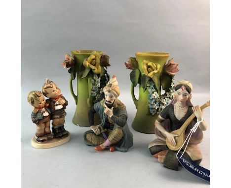 GERMAN GOEBEL FIGURE OF TWO CHILDREN, printed mark to base, along with two ceramic Persian figures of a seated man and woman,
