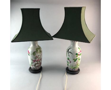 PAIR OF CERAMIC LAMPS, of Eastern design, decorated with flowers and birds, 35cm high