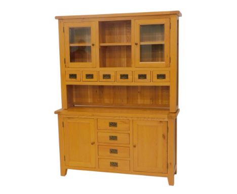 A light oak kitchen dresser, with an arrangement of doors, spice drawers, etc., 200cm high, 150cm wide, 45cm deep. 