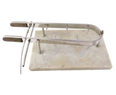 A Demeynck meat joint clamp or holder, with marble base, and wooden handles, the base 43cm long. 