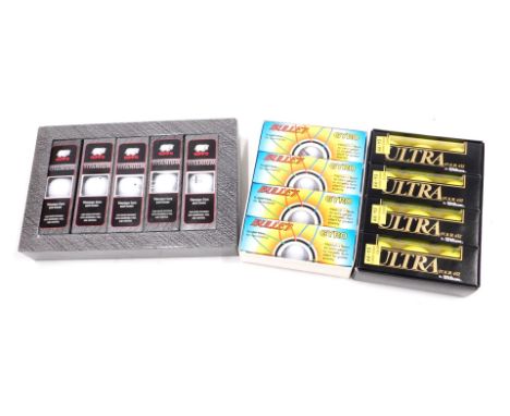 A box of fifteen Hippo double titanium golf balls, a box of Bullet Gyro titanium golf balls, and a box of Wilson ultra tour 4